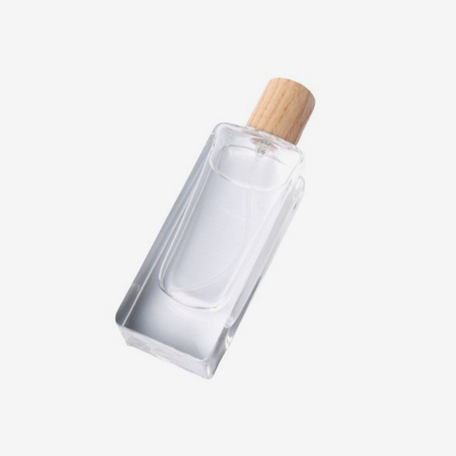 Perfume bottle with wooden cover